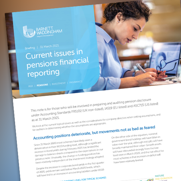 A woman sits at a desk, reviewing documents on a computer screen about pensions financial reporting. The context includes informational text about accounting standards and pension schemes dated March 31, 2021.