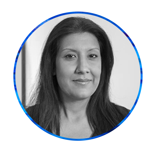 A person with long dark hair smiles, facing the viewer, surrounded by a vibrant blue abstract background. The circular cropping emphasizes their expression and draws attention to their features.