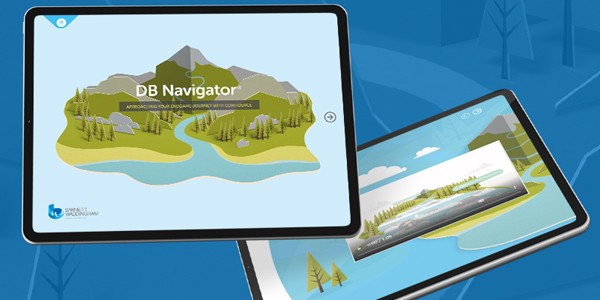 A digital tablet displays a colorful landscape featuring mountains and trees, labeled “DB Navigator.” It showcases a river winding through a natural setting, with a user interface for navigation.