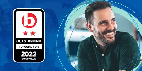 A man with a smile is positioned on the right, surrounded by circular blue graphics. A badge on the left reads “OUTSTANDING TO WORK FOR 2022” with a logo and two stars.