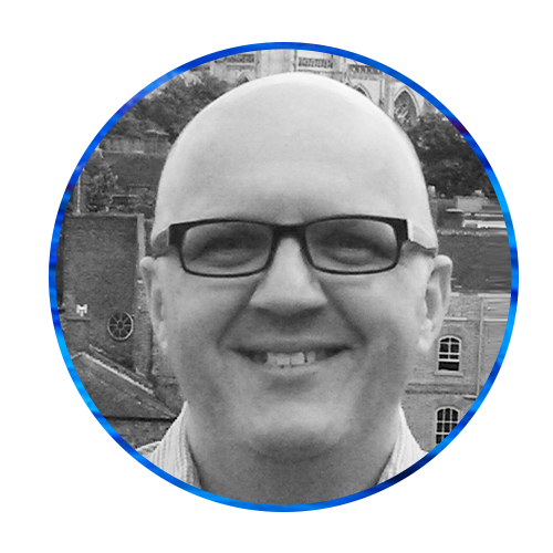 A bald man with glasses smiles in a circular frame. The background features blue and textured abstract patterns, creating a visually vibrant and engaging context for the portrait.