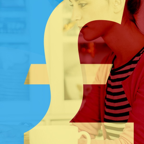 A person sits at a desk, focused on a laptop, surrounded by a blurred kitchen setting. A large, transparent pound symbol overlays the scene, emphasizing a financial theme.