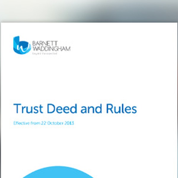 A document titled "Trust Deed and Rules" is prominently displayed. It states "Effective from 22 October 2013." The background is blurred, suggesting an office or professional setting.