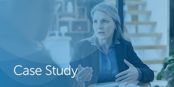 A woman in professional attire gestures while discussing something serious in an office setting. Behind her, a staircase and shelves with items are visible, suggesting a collaborative atmosphere. The text "Case Study" appears prominently.