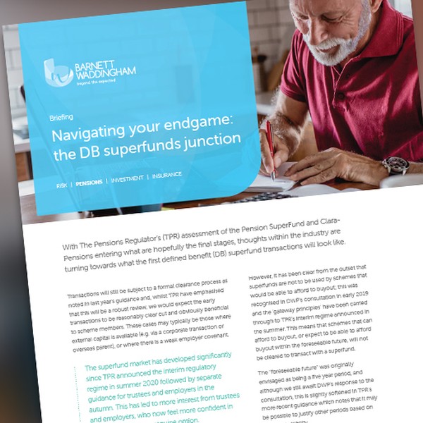 A man with gray hair is reading a document on a table. He appears engaged in the content. The environment suggests a casual workspace, with soft lighting and minimal distractions. 

Text in the image: "Navigating your endgame: the DB superfunds junction" 