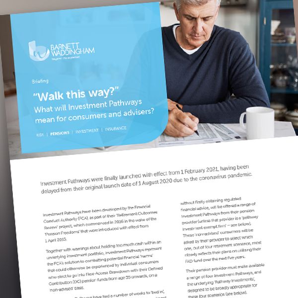 A man in a blue striped shirt sits at a desk, holding a document while looking thoughtfully. A cup rests nearby, and a presentation slide titled "Walk this way?" is visible above him.