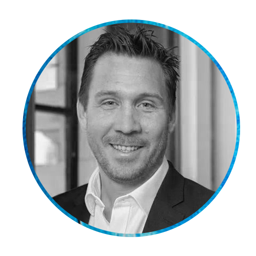 A man with short hair and a friendly smile is depicted in a circular frame. The background features a textured blue design, suggesting a professional or modern environment.