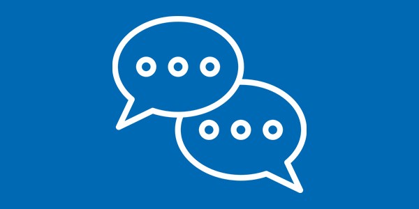 Two speech bubble icons, one overlapping the other, each containing three dots, suggest ongoing conversation or messaging. The background is a solid blue color, enhancing visibility.