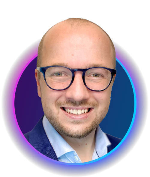 Smiling person with short hair and glasses is presented in a circular, vibrant frame. The background features a gradient of colors, enhancing the focus on the person's face and expression.