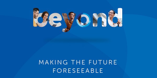 The word "beyond" features images of diverse individuals within its letters, conveying a sense of connection and progress. Below, the text reads: "MAKING THE FUTURE FORESEEABLE." The background is a vibrant blue.