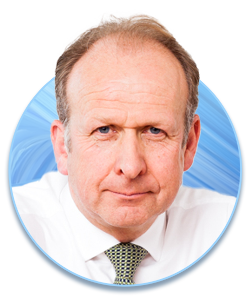 A middle-aged man with a serious expression is looking directly at the viewer. He has light brown hair and wears a white shirt with a patterned tie, set against a blue abstract background.