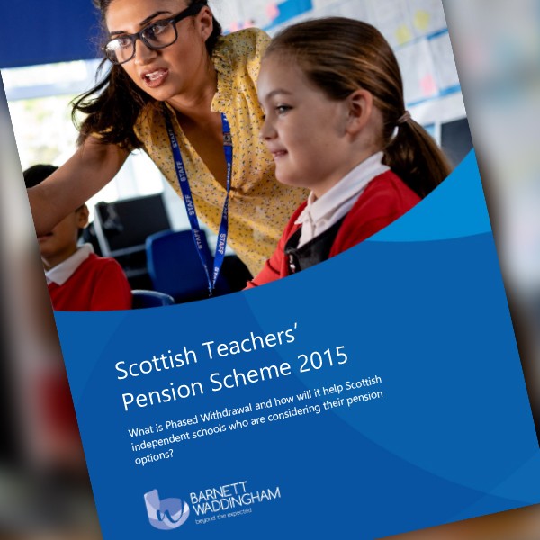 A woman in a colorful shirt assists two schoolchildren in a classroom. The children are engaged, with one girl smiling as they discuss the "Scottish Teachers’ Pension Scheme 2015" document.