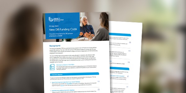 A document titled "New DF Funding Code" is placed on a table, with two people engaged in conversation nearby. The background suggests an indoor setting with soft lighting.