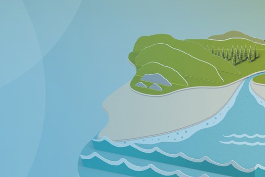 A stylized landscape features two green hills flanking a winding river. The river flows into a body of blue water, surrounded by sandy shores and gentle waves, under a light blue sky.