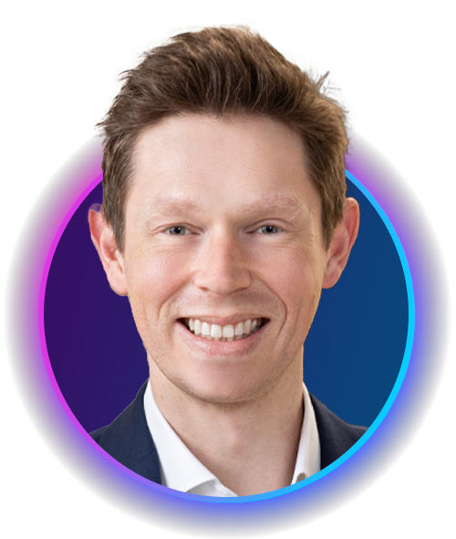 Smiling individual with short, light brown hair and wearing a dark jacket over a white shirt, set against a gradient circular backdrop with blue and purple tones.