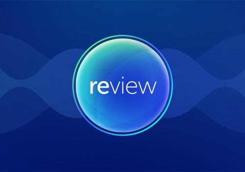 A circular, multicolored graphic contains the word "review" in a modern font, set against a deep blue background with wavy patterns, suggesting a digital or technological context.