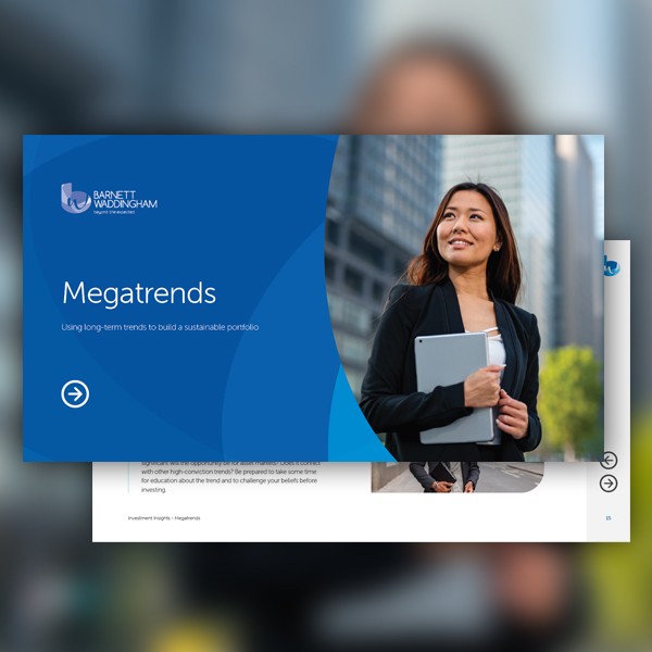 A woman holds a tablet and smiles while standing in a city environment. She wears a black jacket, and the background features modern buildings. A presentation slide titled "Megatrends" is visible above her.