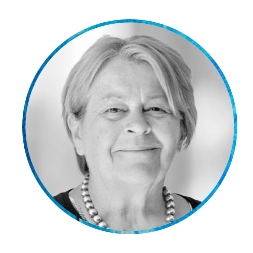 A round portrait of a woman with short gray hair and a smile, wearing a pearl necklace. The background features a textured blue pattern, providing a vibrant contrast to her image.