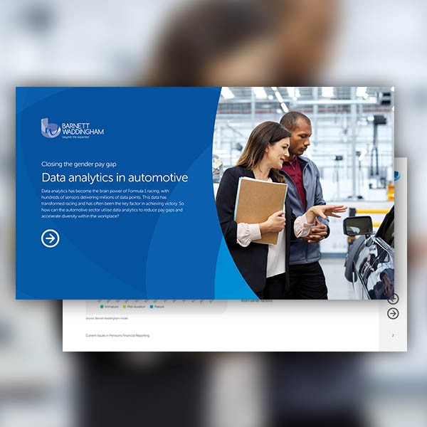 A woman and a man discuss data analytics in an automotive setting. She holds a folder, looking engaged, while he gestures towards a car. The background features a modern workshop environment. 

Text: 
"Closing the gender pay gap  
Data analytics in automo